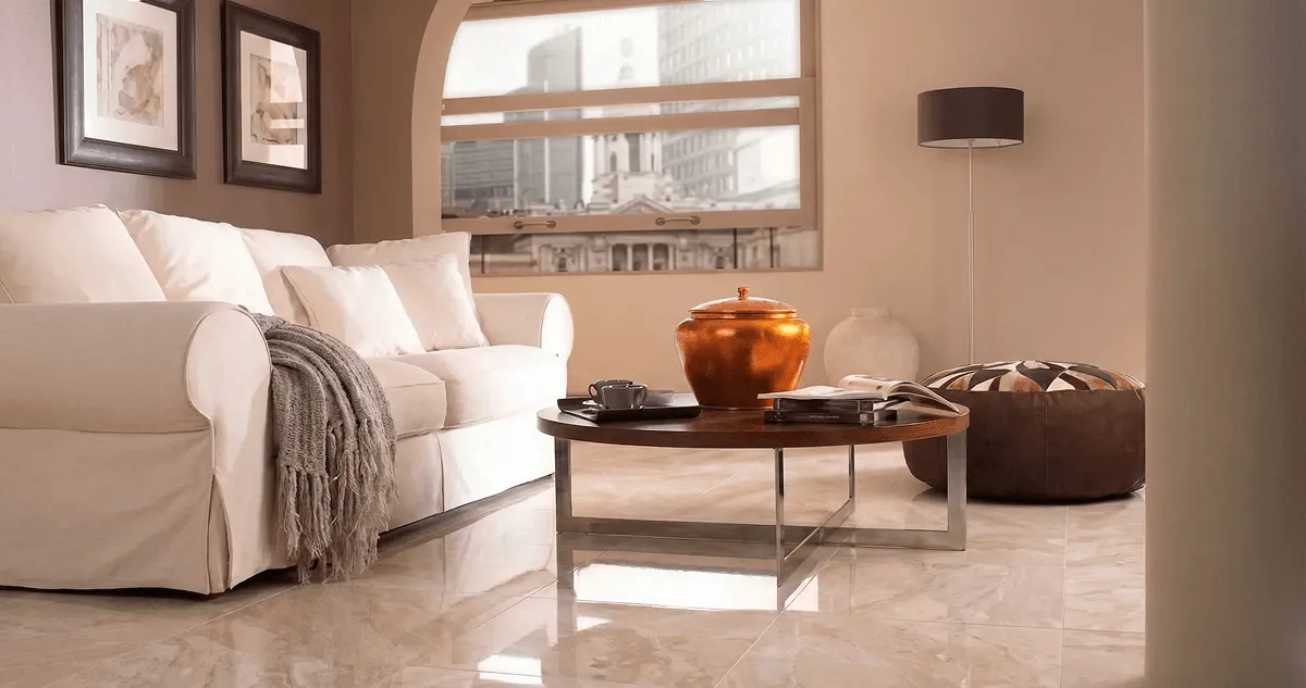 Modern living room with professionally installed marble flooring, a beige sofa, coffee table in Denver, CO