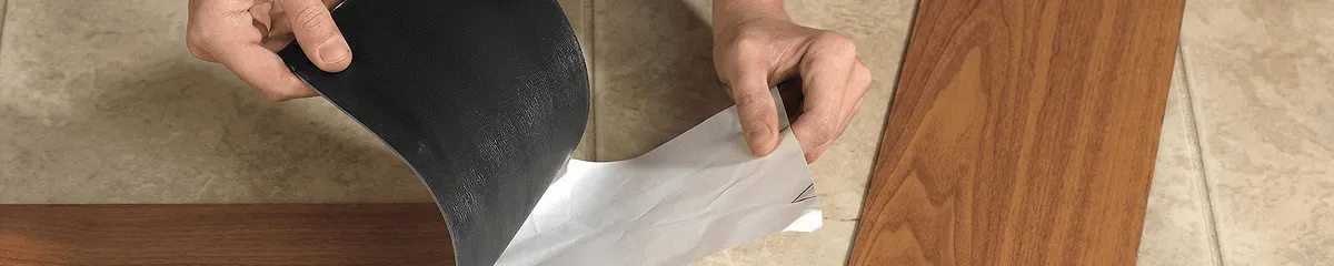 A professional installing vinyl flooring in Denver, CO